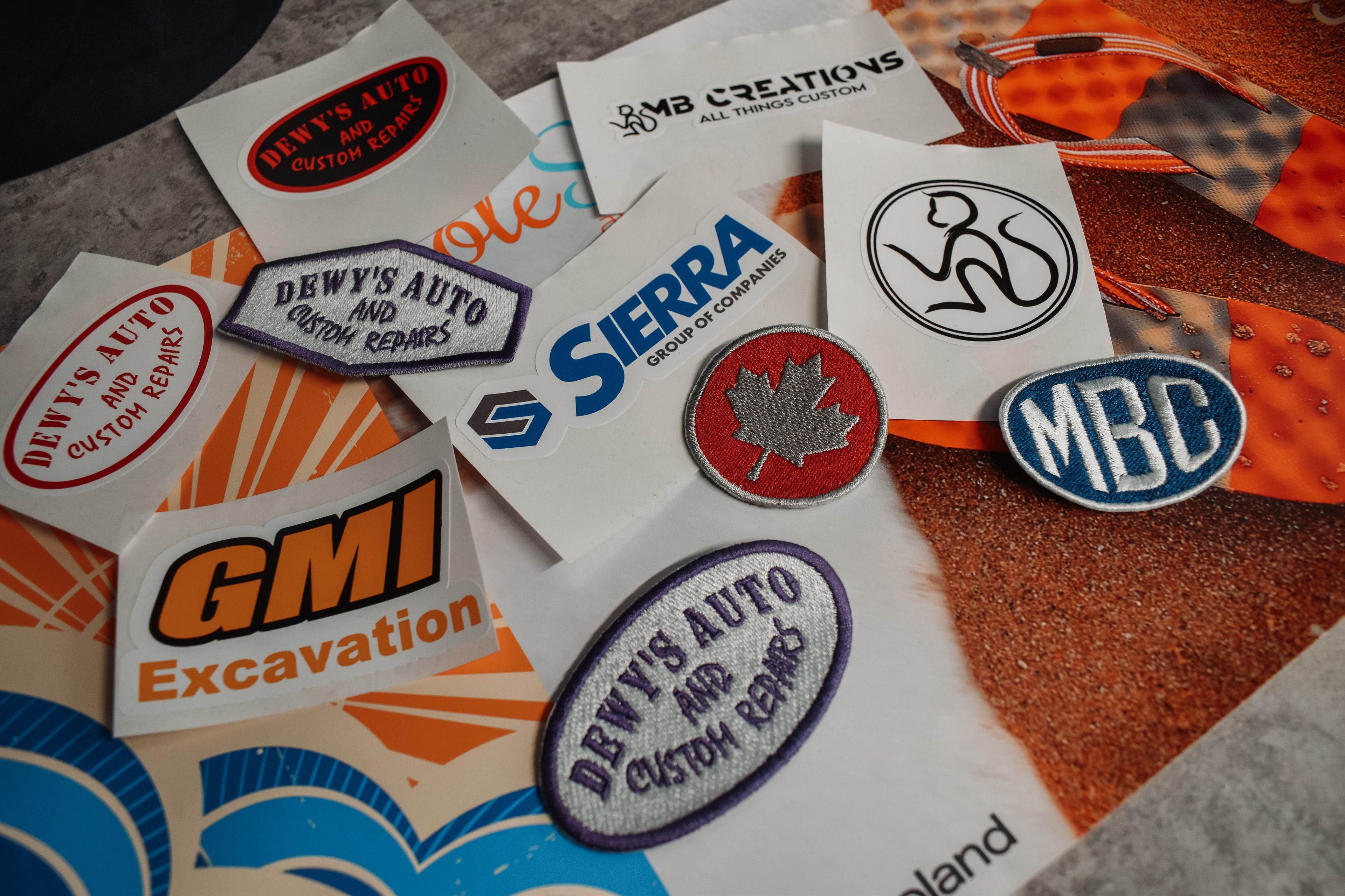 Collection of various business logos on vinyl stickers. Corporate branding stickers.